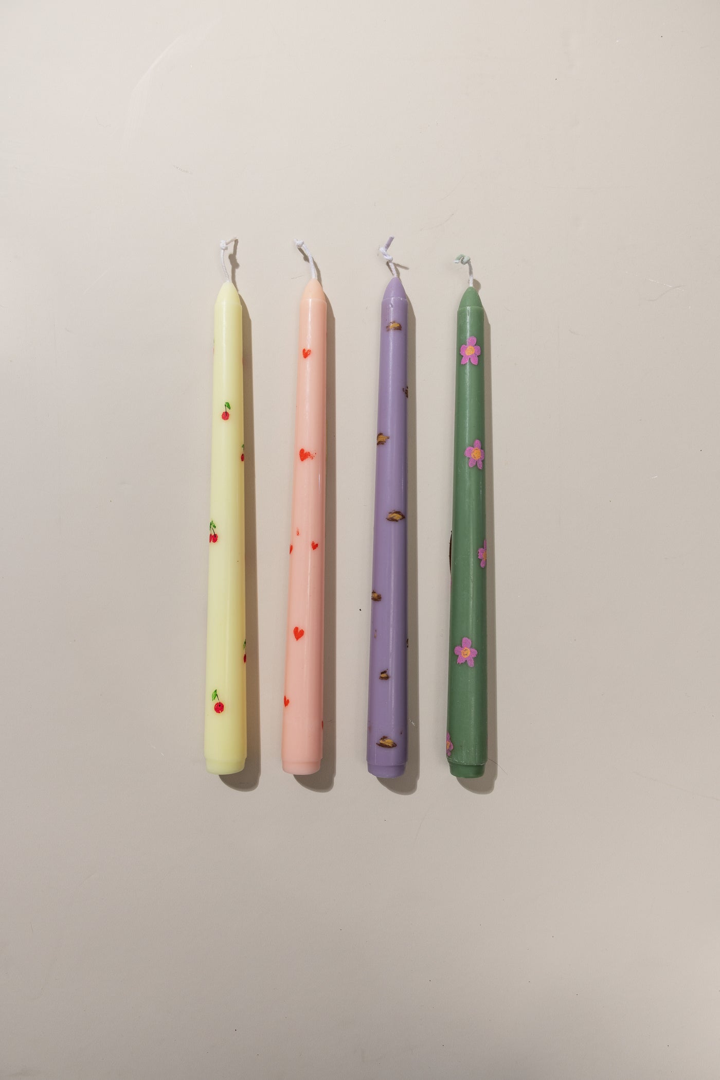 SET OF FOUR TAPER CANDLES